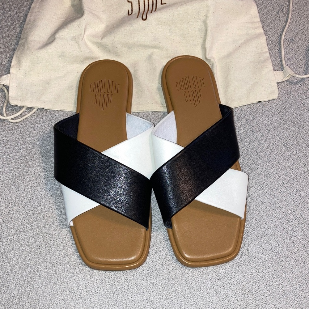 Charlotte Stone “Kim” slide sandals in black and white. Size 9.